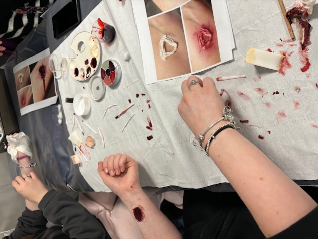 Image of participants using special effects make-up